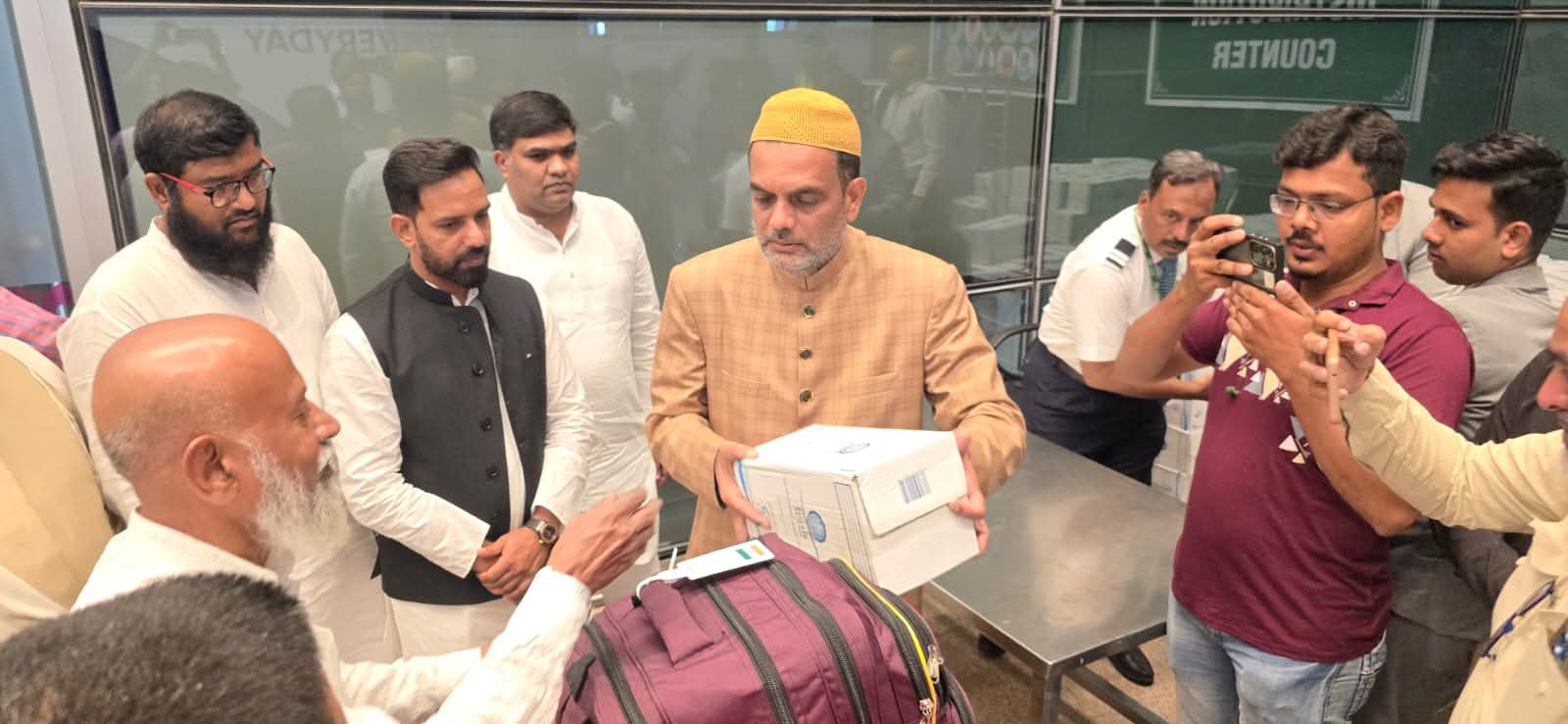 On the occasion of Haj -2024 Arrival of Haj pilgrims and distribution of Zam zam along with Janab Mohammed Faheemuddin Qureshi  vice chairman and president of the TMREIS, and junaid salik Assistant commissioner of Custom and other officers also there